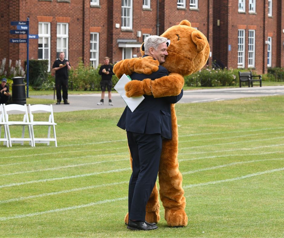Mr Neeson hugs Bluey the Bear