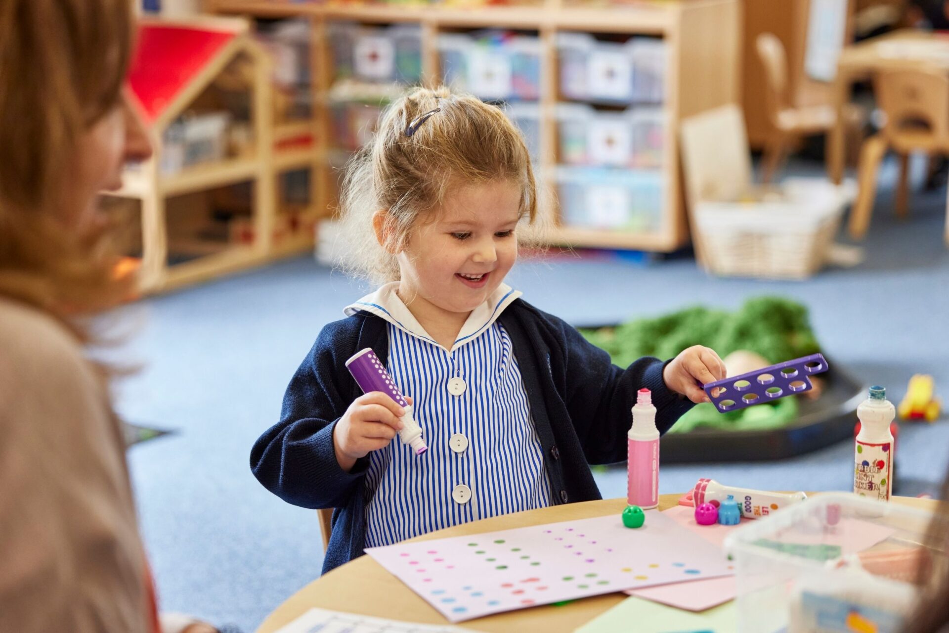 A girl is doing mathematics using Numicon.