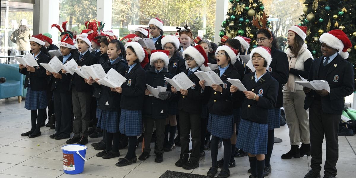 The BCS Chapel Choir sing an array of Christmas carols for the people of the Queen Elizabeth Hospital.